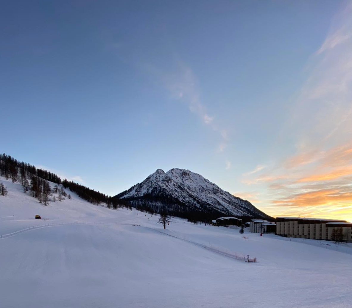 Pink-orange sunset over the ridges of the Via Lattea